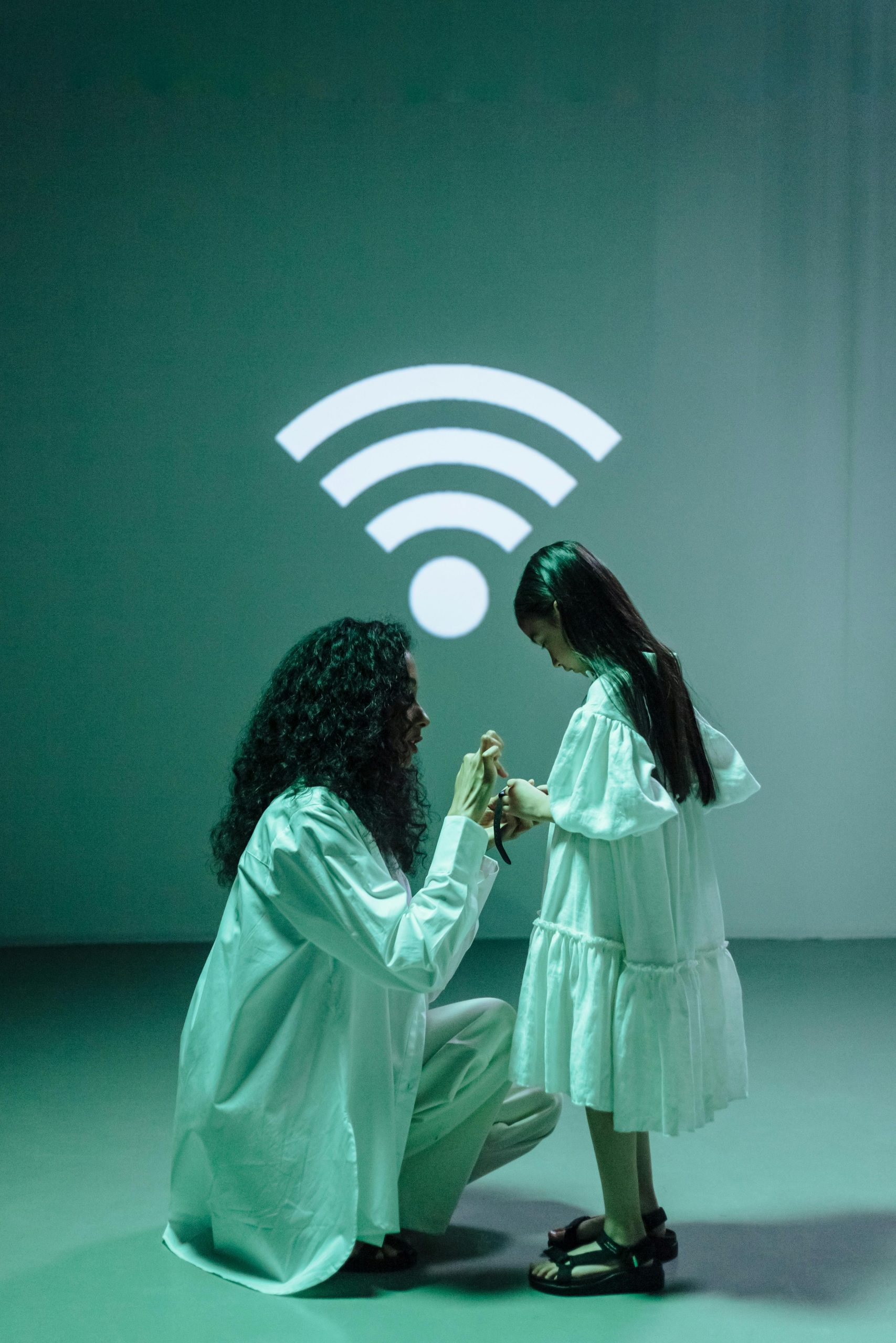 A mother and daughter interact under a WiFi symbol, highlighting digital bonding.